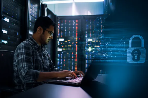 366BED Games — Explore our rich library of casino classics A woman smiling while playing online games on her laptop, surrounded by neon casino elements, showcasing 366BED’s diverse game collection.